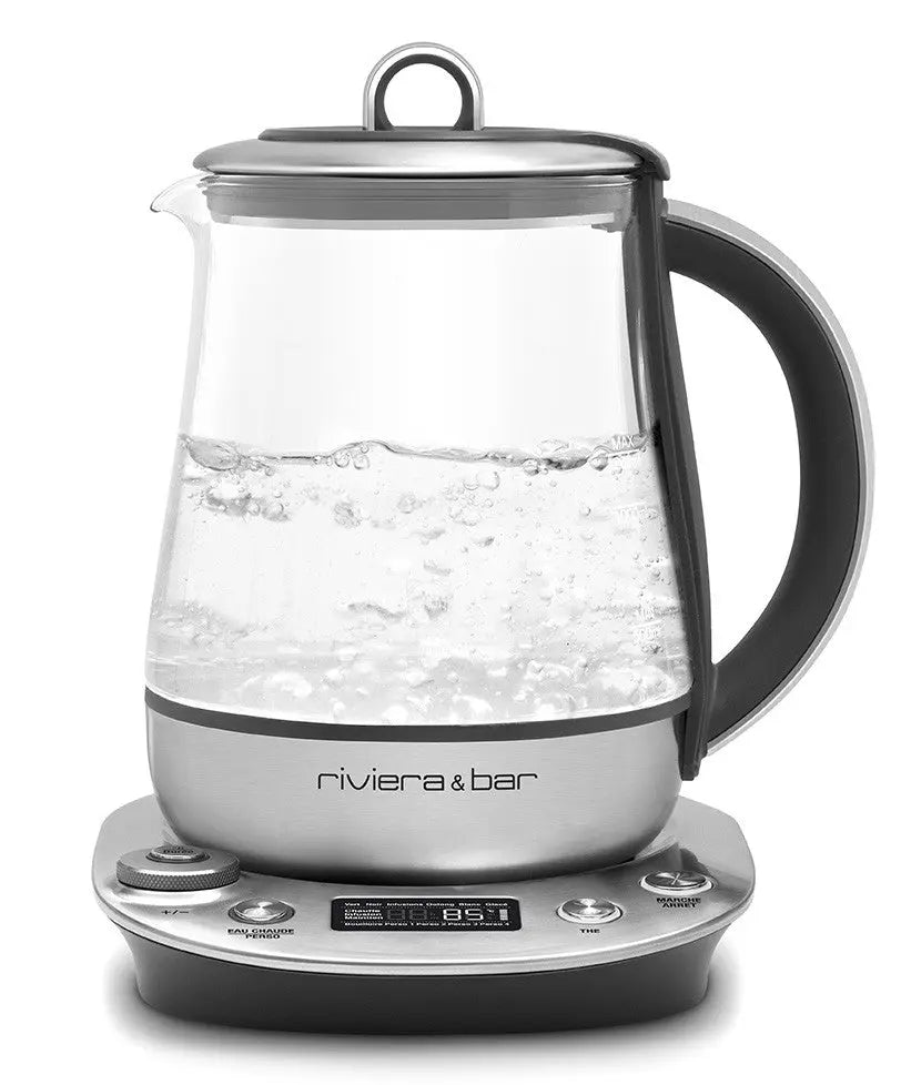 Bouilloire électrique en verre avec base argentée.