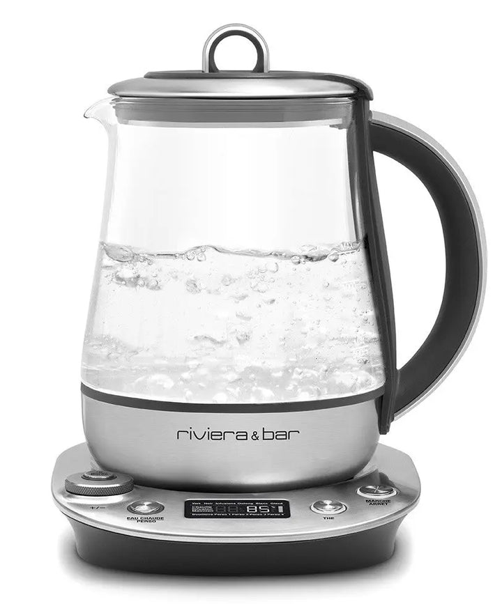 Bouilloire électrique en verre avec base argentée.
