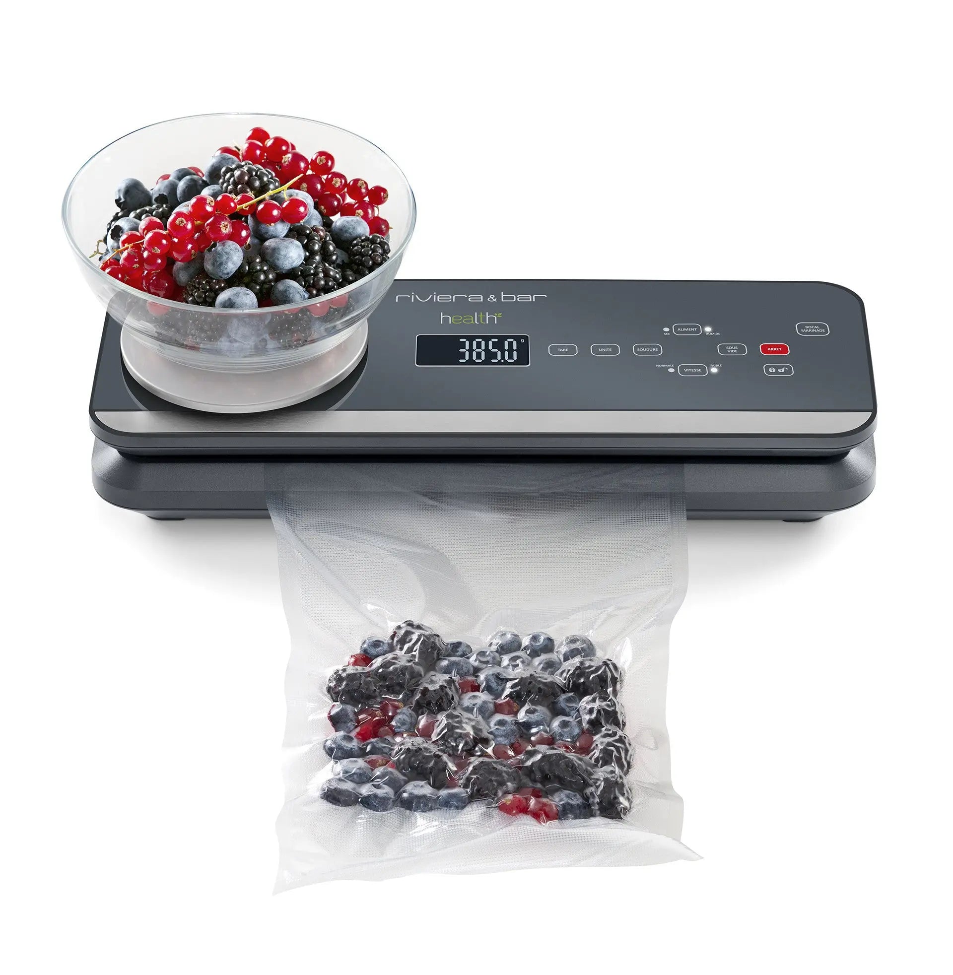 Machine sous vide avec fruits rouges.
