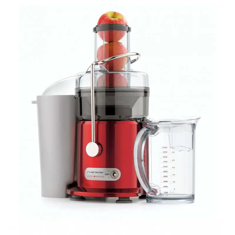 Extracteur de jus rouge avec pommes.
