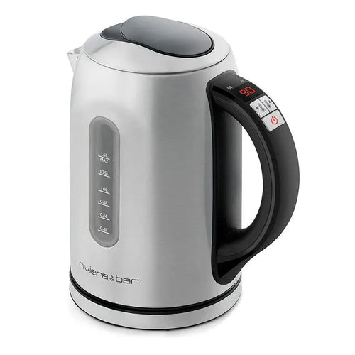 La Bouilloire Louna Inox 1.5L de riviera&bar est de couleur argentée avec une poignée noire, un indicateur de niveau d'eau sur le côté, un affichage digital de la température et le logo de la marque près de la base. Un contrôle thermique assure une chauffe parfaite.