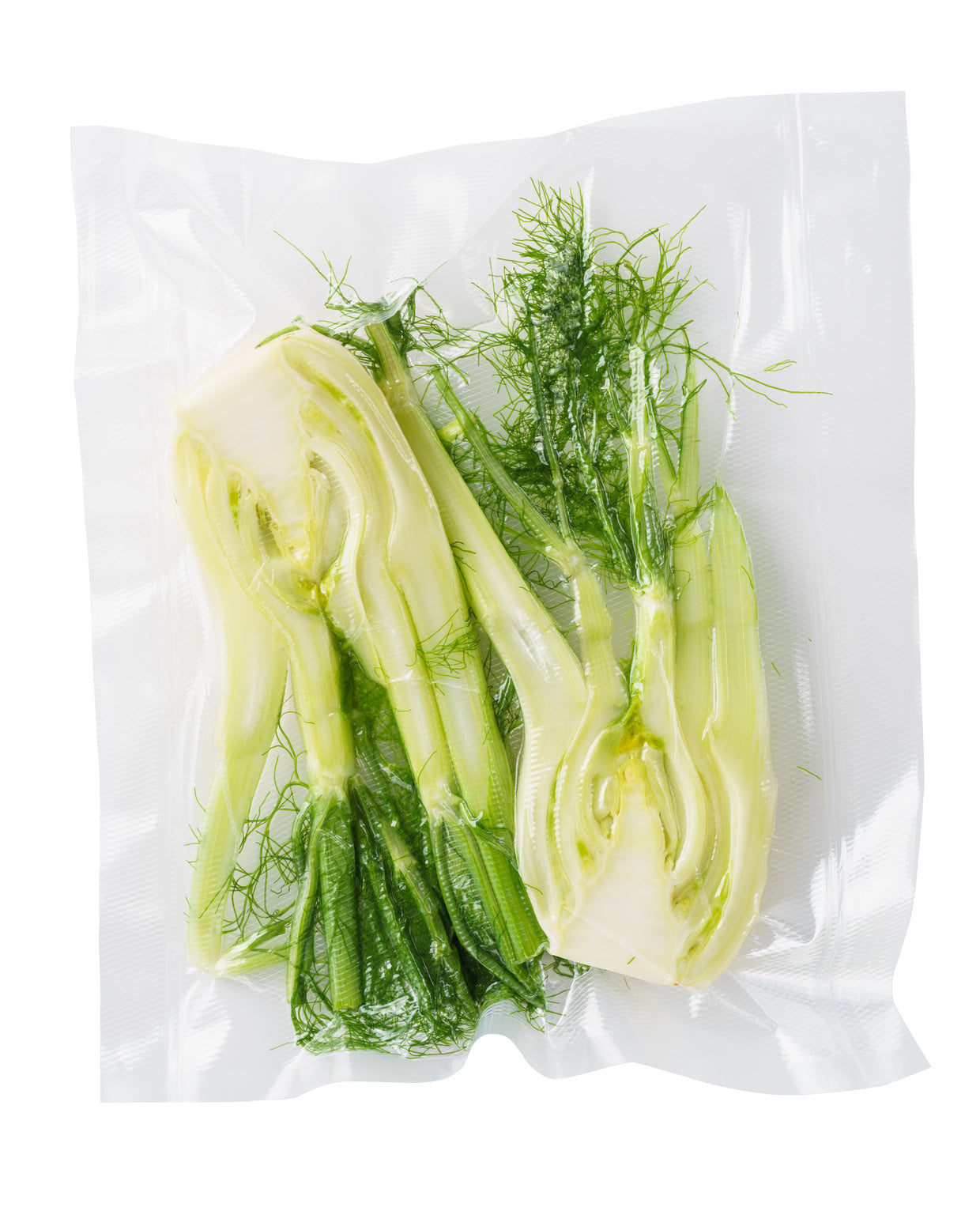 The riviera&bar Appareil de mise sous vide avec dateur intégré scelle des sacs contenant fenouil frais tranché, préservant la qualité des aliments et empêchant l'oxydation.