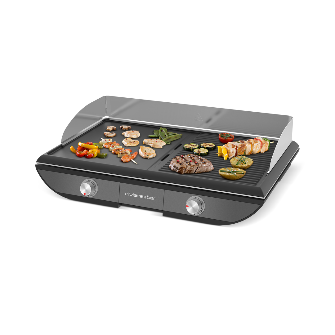 La Plancha 2 zones de cuisson de riviera&bar est un gril électrique de table avec deux boutons et des zones de cuisson indépendantes, vous permettant de griller facilement des légumes, du poulet, des brochettes ou des steaks sur sa grande surface antiadhésive.