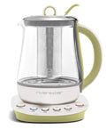 Théière électrique en verre et acier inoxydable, base blanc cassé et vert amande.