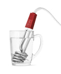 Thermobloc de voyage dans un verre d'eau.